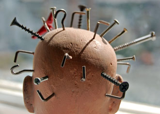 Dummy head with nails and screws